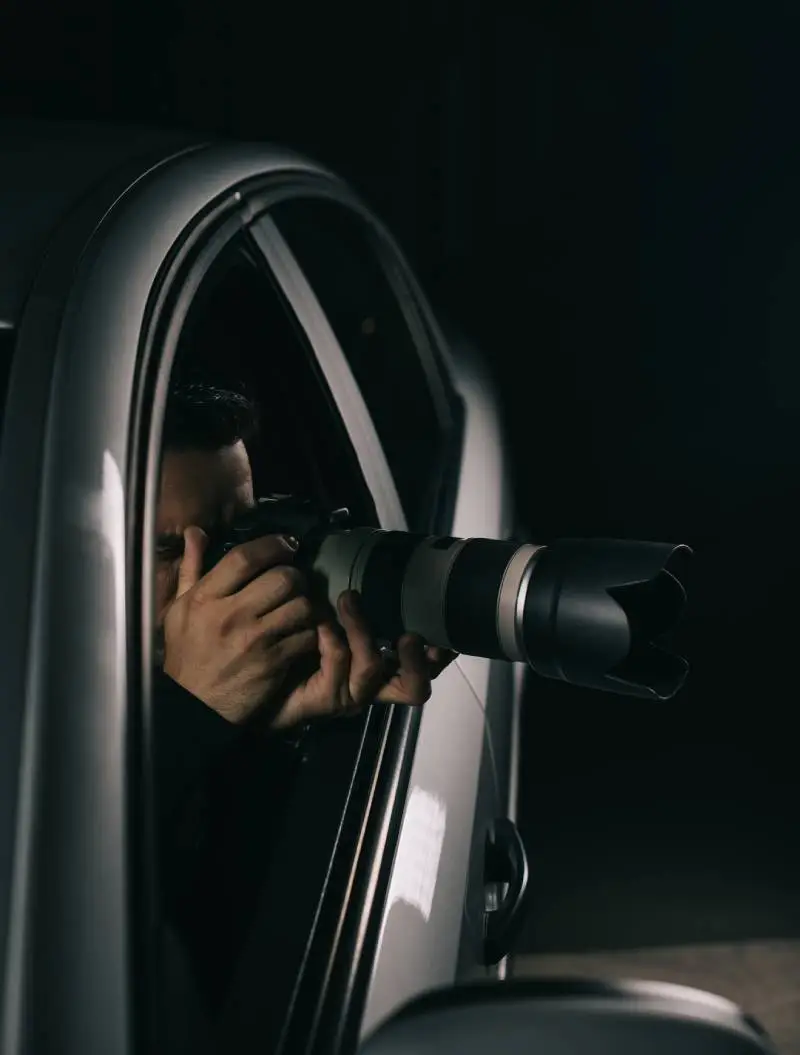 Agent of Uttarakhand Detective Services taking photographs for evidence